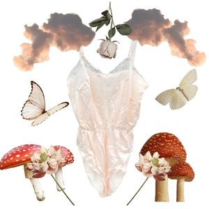 Vintage pastel peach bodysuit with lace details.